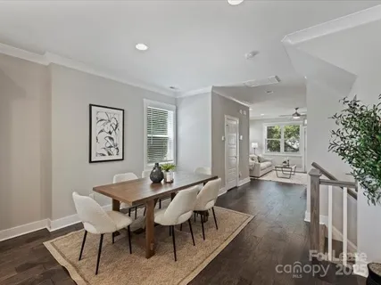 a view of a dining room with furniture and window