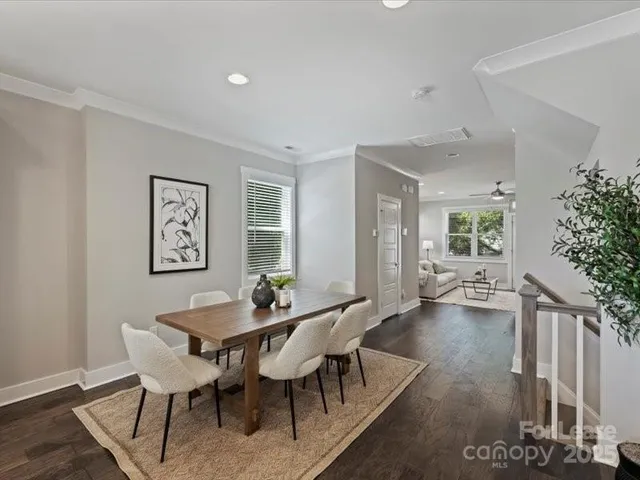 a view of a dining room with furniture and window