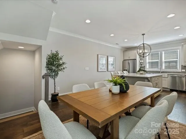 a view of a dining room with furniture and window