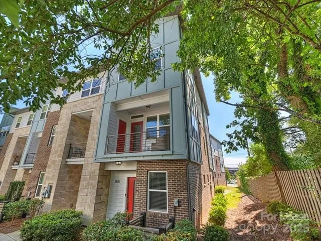 a view of a house with a tree
