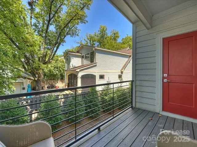 a view of a wooden deck with a yard