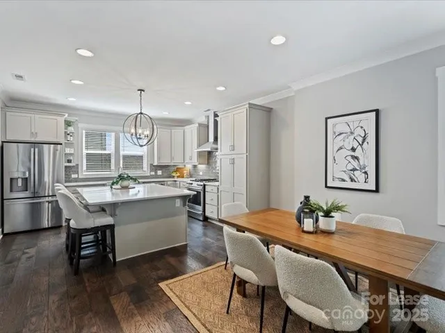 a kitchen with a table and chairs in it