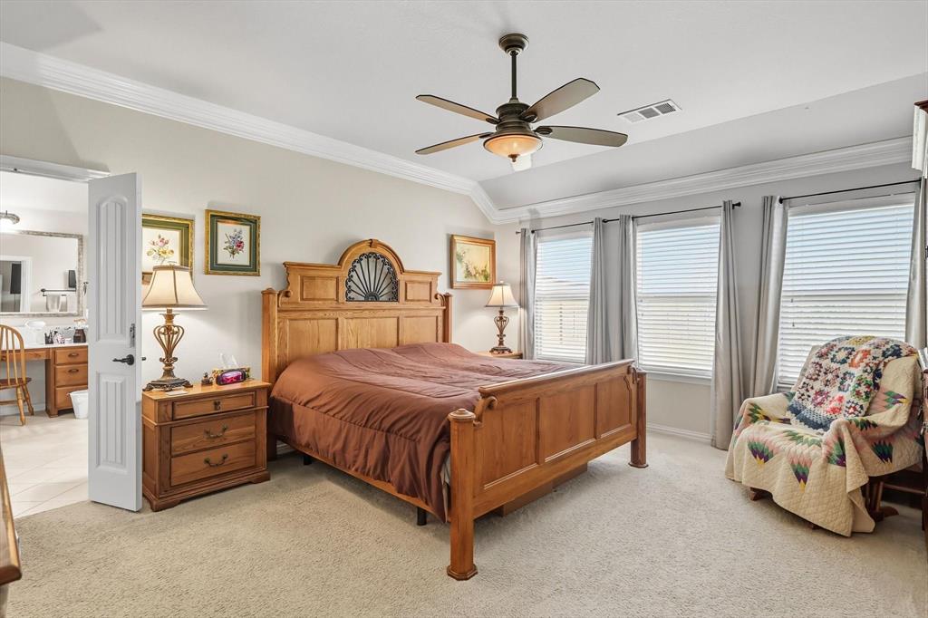 142 High Ridge Court Decatur, TX 76234 - Photo 13 of 40 a bedroom with a bed and window