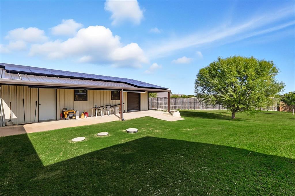 142 High Ridge Court Decatur, TX 76234 - Photo 32 of 40 a view of backyard with garden