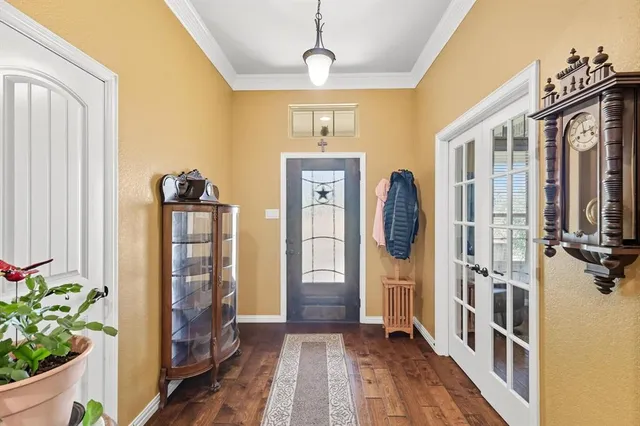 a view of front door with wooden floor
