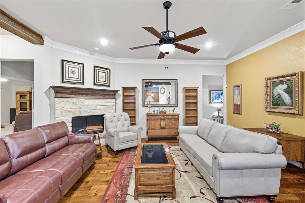 142 High Ridge Court Decatur, TX 76234 - Photo 10 of 40 a living room with furniture and a fireplace