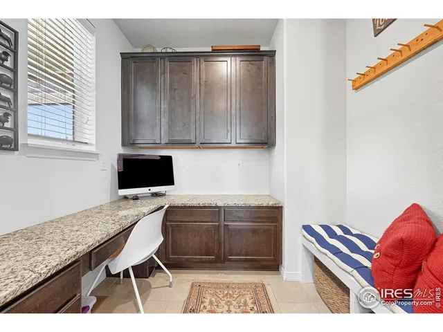 a living room with furniture and a dining table with kitchen view