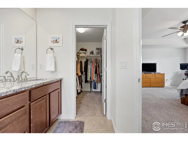 a bedroom with a bed and cabinets