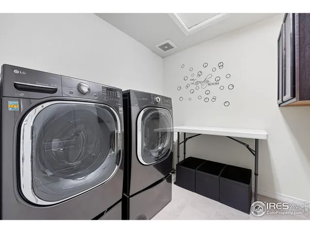 a living room with patio furniture and garden