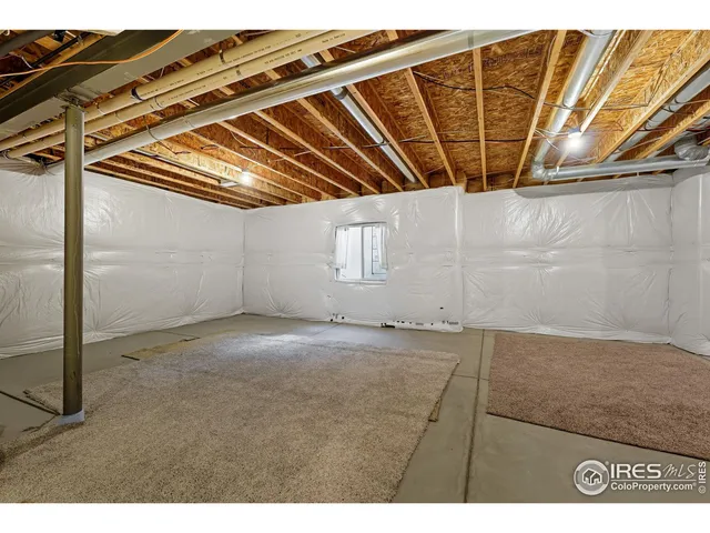 a view of a chair and tables in the balcony