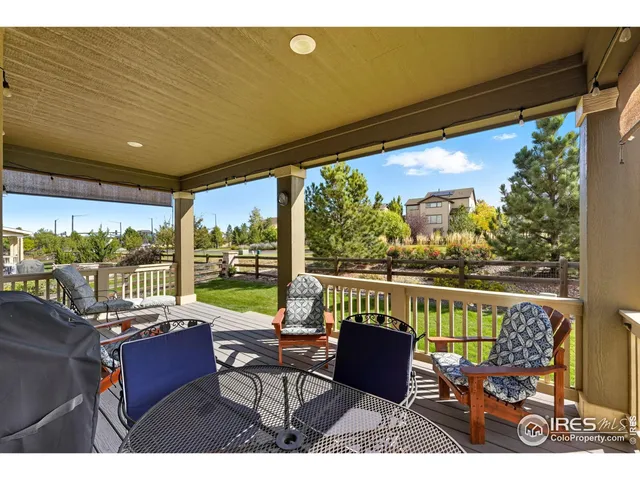 a front view of a house with swimming pool having outdoor seating