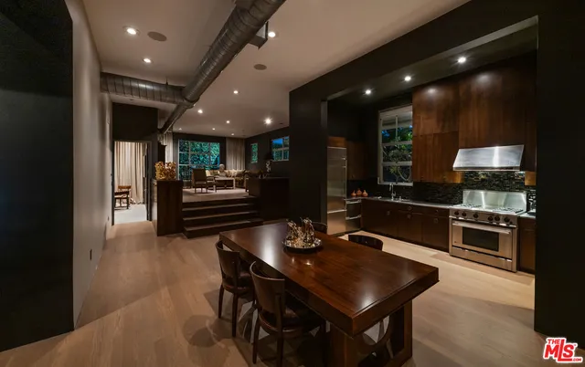 a kitchen with a sink cabinets and stainless steel appliances