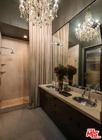 a bathroom with a double vanity sink and a mirror