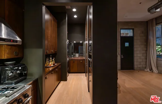 a view of a hallway with living room and furniture