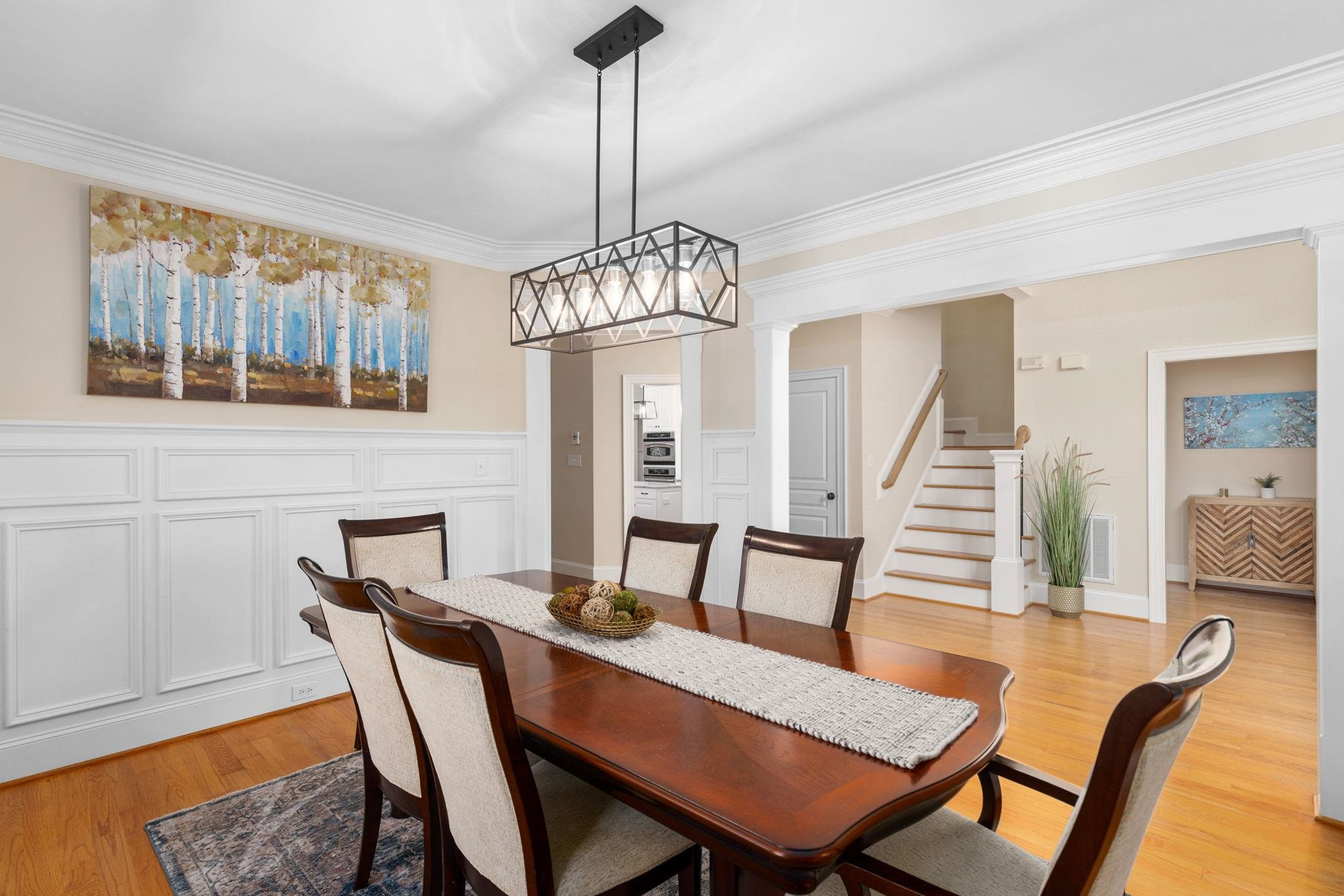 3720 Grandbridge Drive Apex, NC 27539 - Photo 15 of 81 a view of a dining room with furniture and wooden floor