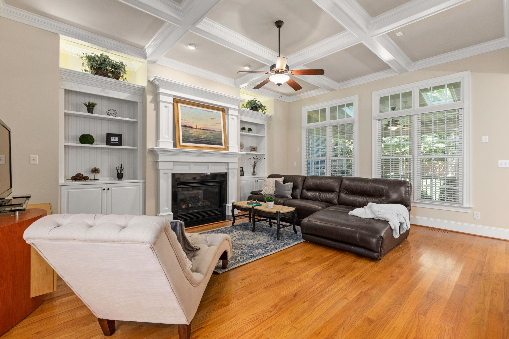 3720 Grandbridge Drive Apex, NC 27539 - Photo 18 of 81 a living room with furniture fireplace and a flat screen tv