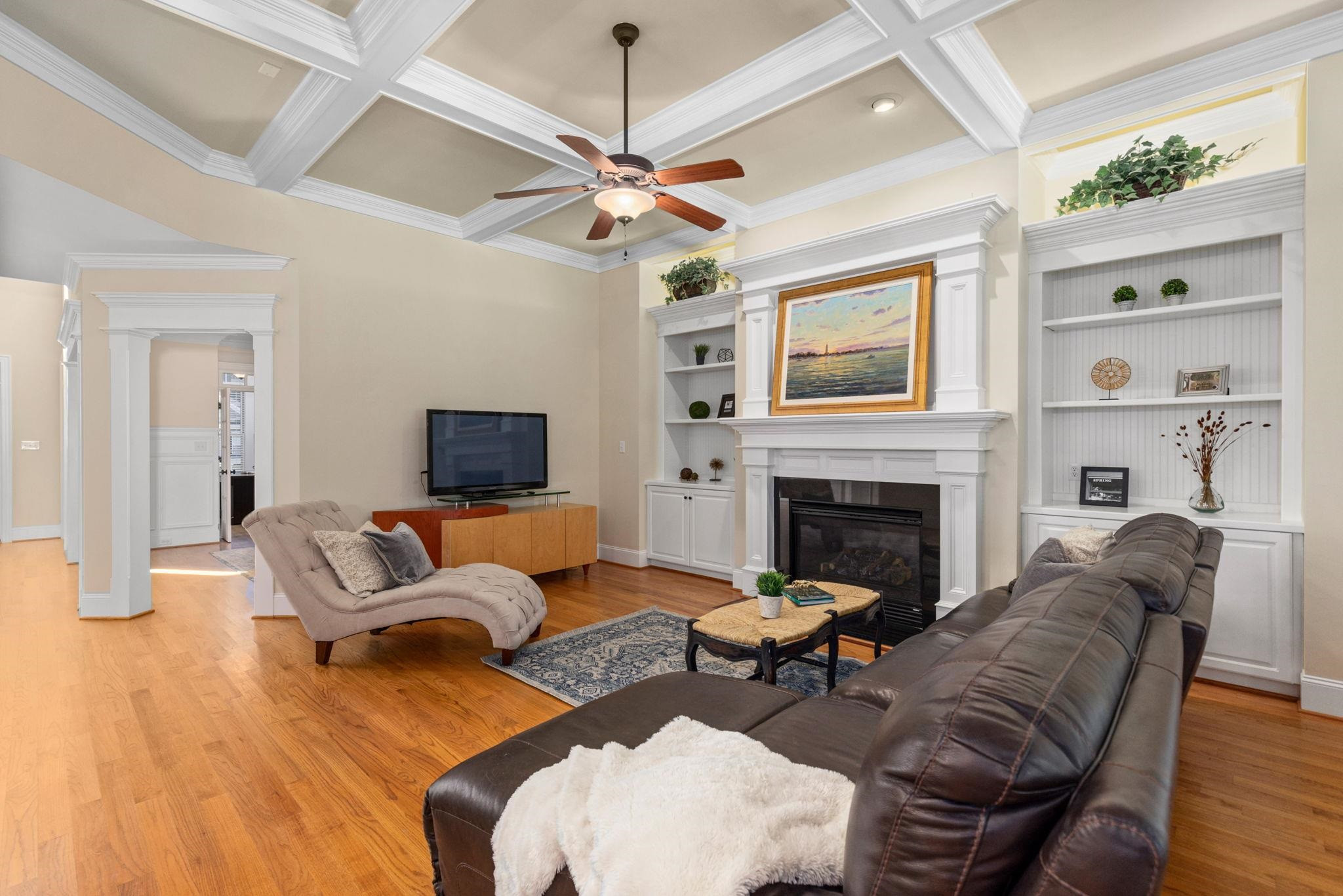 3720 Grandbridge Drive Apex, NC 27539 - Photo 20 of 81 a living room with furniture a fireplace and a flat screen tv
