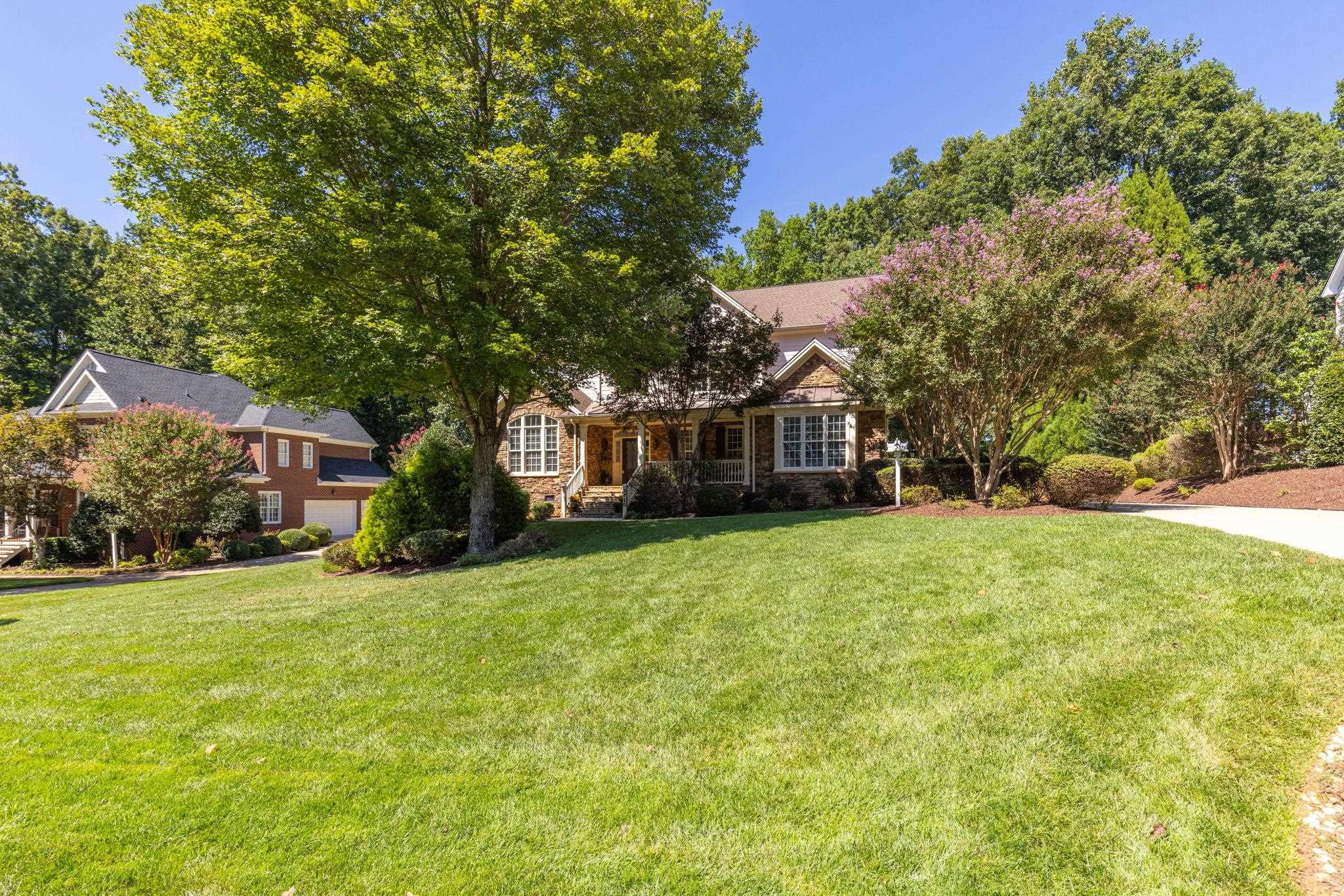 3720 Grandbridge Drive Apex, NC 27539 - Photo 2 of 81 a front view of a house with a garden