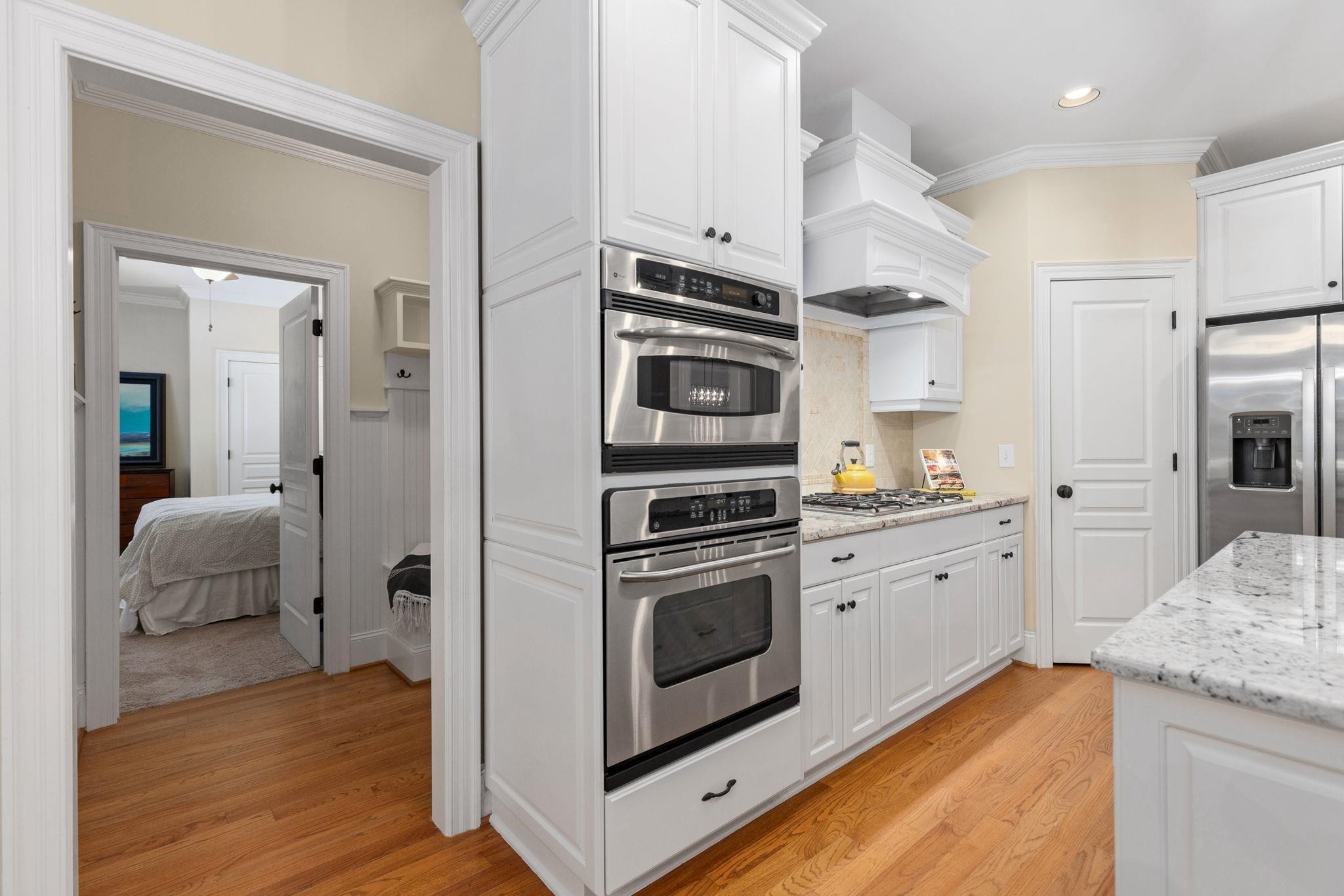 3720 Grandbridge Drive Apex, NC 27539 - Photo 25 of 81 a kitchen with granite countertop stainless steel appliances and wooden floor