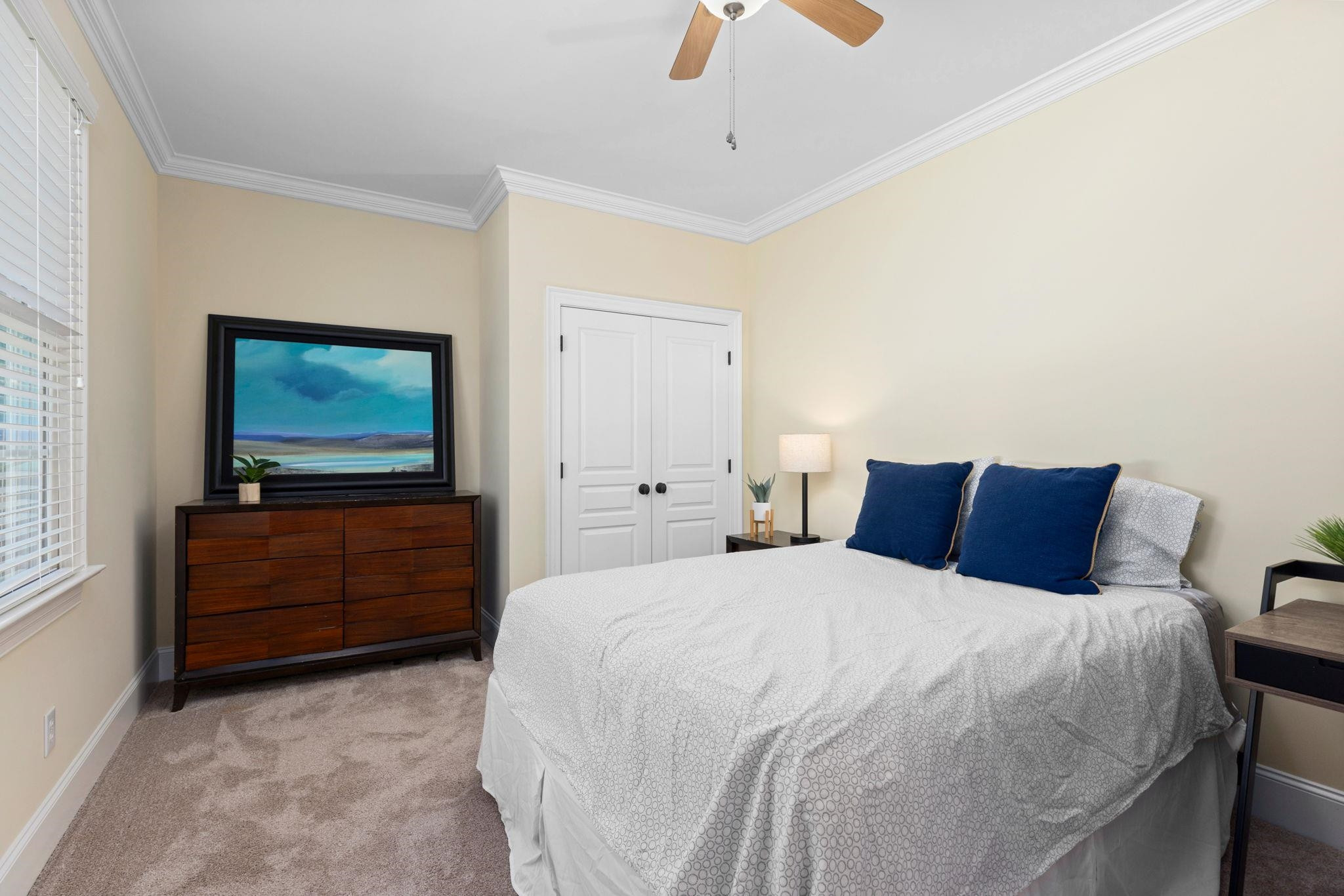 3720 Grandbridge Drive Apex, NC 27539 - Photo 30 of 81 a bedroom with a bed and a flat screen tv