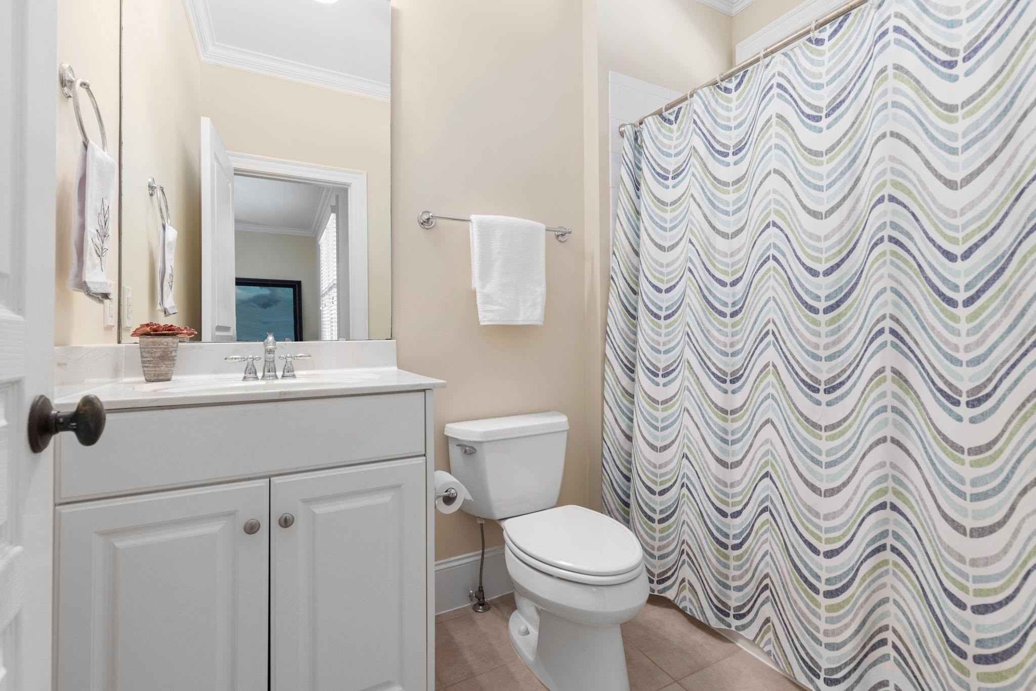 3720 Grandbridge Drive Apex, NC 27539 - Photo 32 of 81 a bathroom with a sink toilet and a mirror