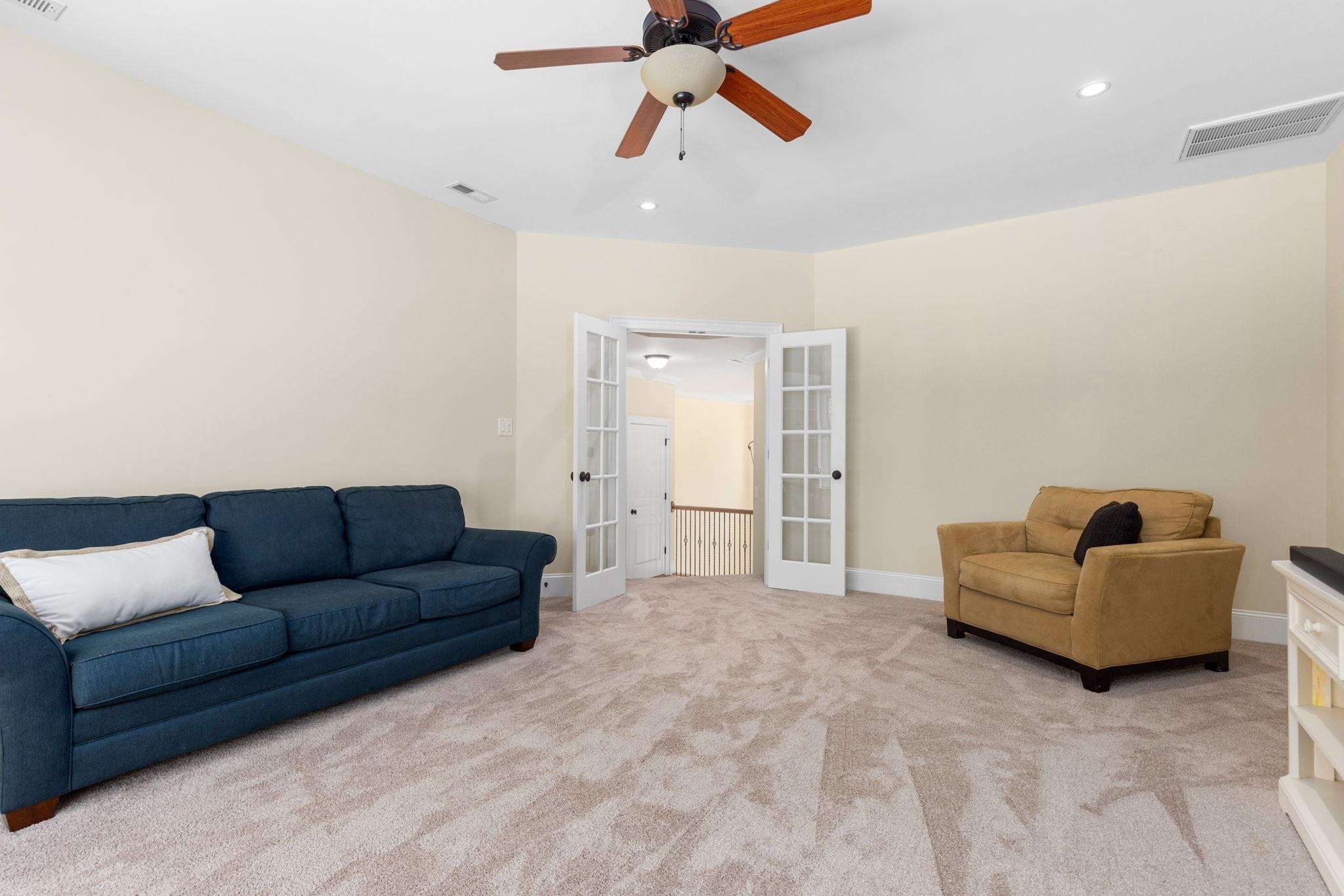 3720 Grandbridge Drive Apex, NC 27539 - Photo 41 of 81 a living room with furniture and a ceiling fan