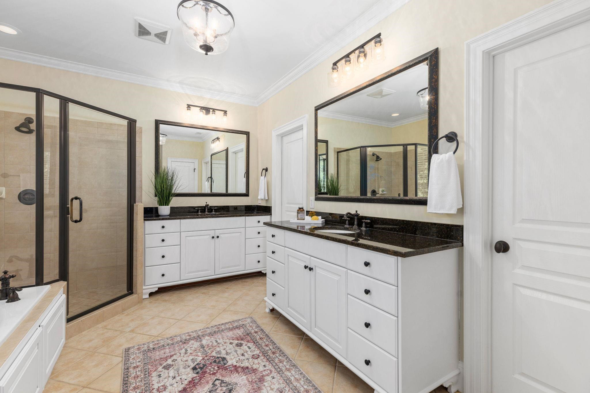 3720 Grandbridge Drive Apex, NC 27539 - Photo 45 of 81 a spacious bathroom with a granite countertop sink mirror and a