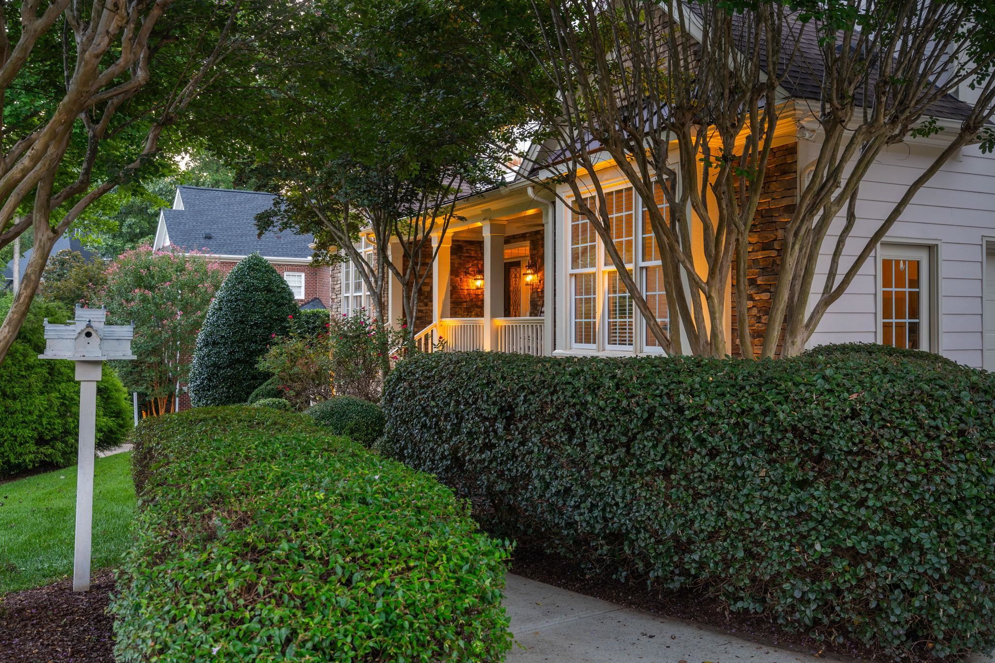 3720 Grandbridge Drive Apex, NC 27539 - Photo 5 of 81 a front view of a house with a garden