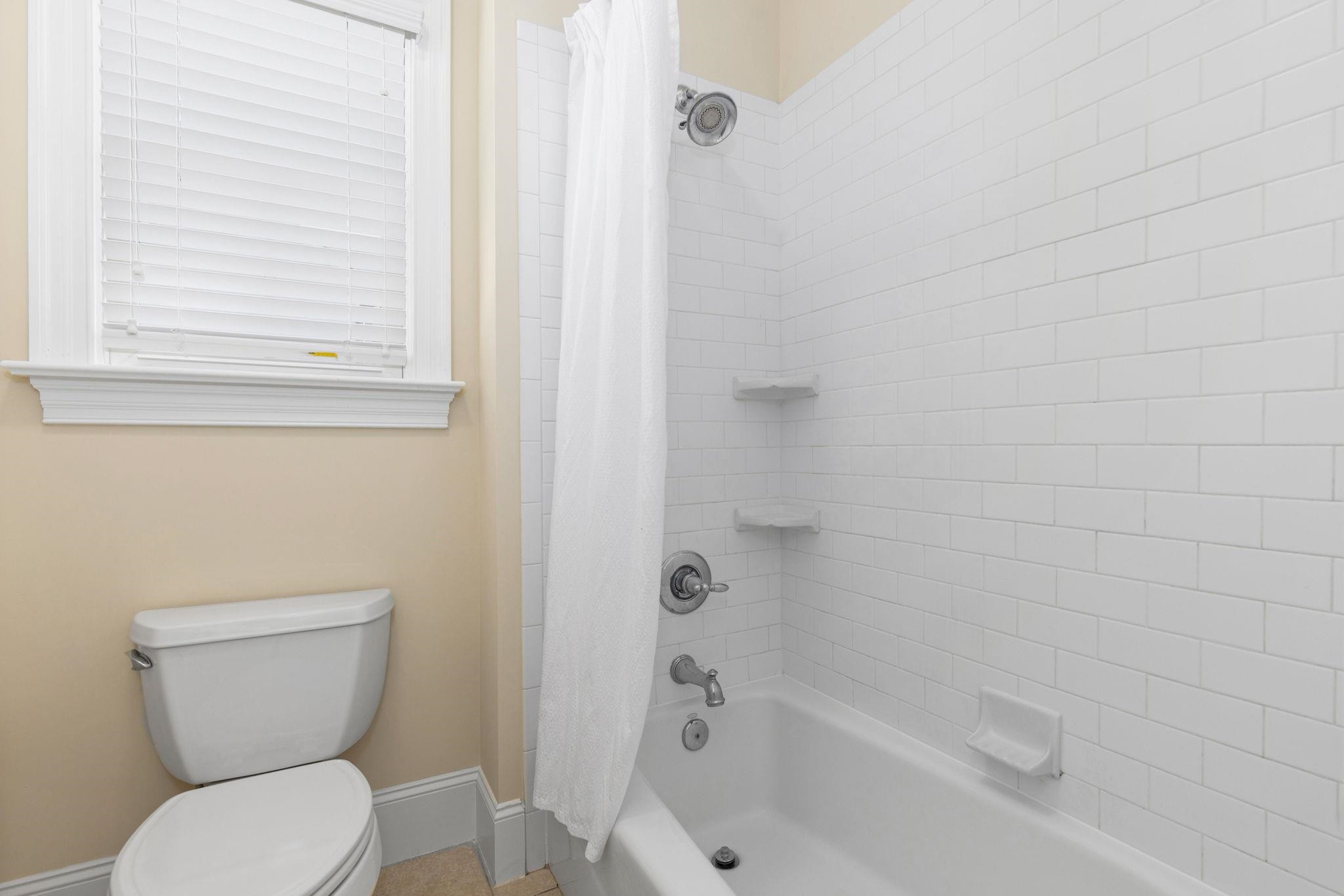 3720 Grandbridge Drive Apex, NC 27539 - Photo 53 of 81 a bathroom with a toilet and a bathtub