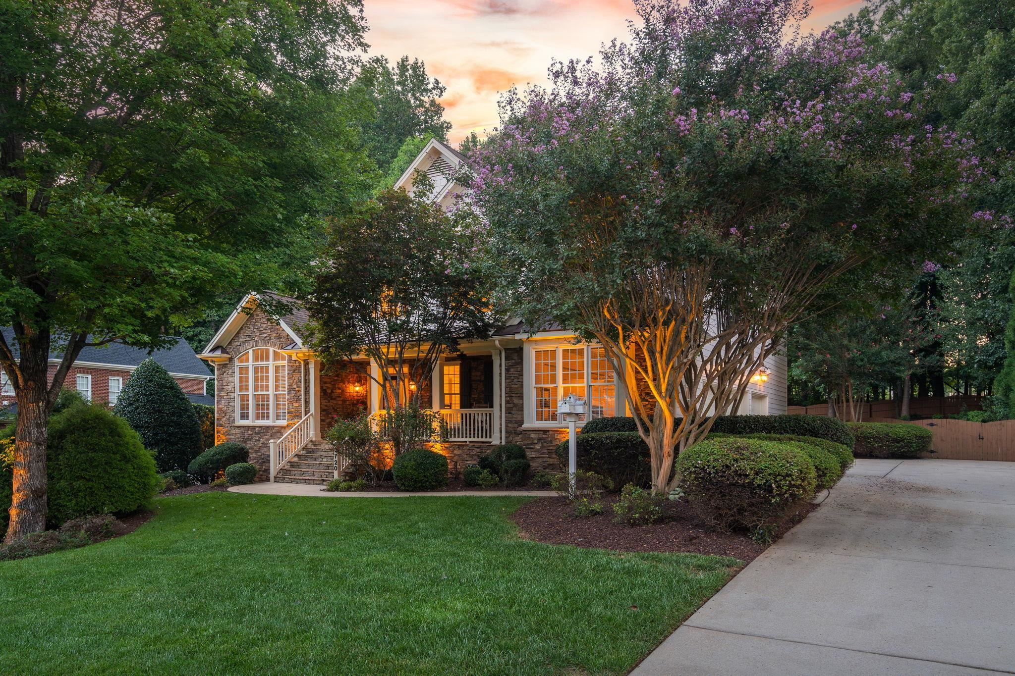 3720 Grandbridge Drive Apex, NC 27539 - Photo 6 of 81 a front view of a house with garden