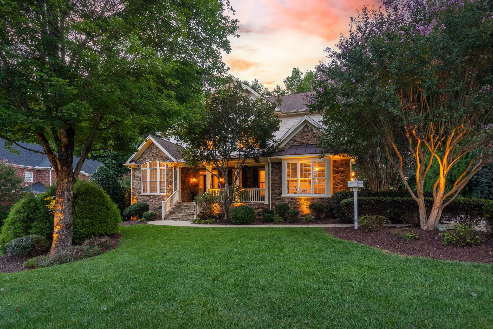 3720 Grandbridge Drive Apex, NC 27539 - Photo 7 of 81 a front view of a house with a yard and trees