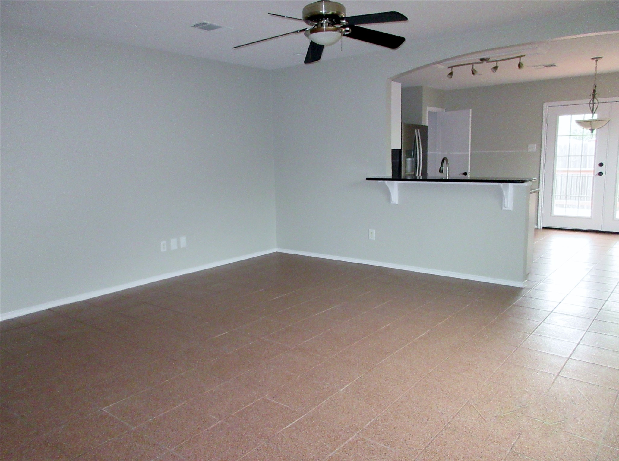 115 Rei Tang Loop Kyle, TX 78640 - Photo 2 of 17 en empty room with wooden floor and mirror