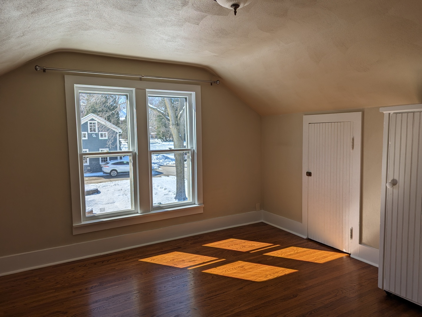 837 West Stephenson Street, Unit UP Freeport, IL 61032 - Photo 15 of 17 a view of empty room with wooden floor and fan