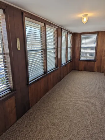 a kitchen with granite countertop cabinets and refrigerator