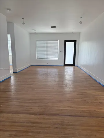 a view of room and hardwood floor