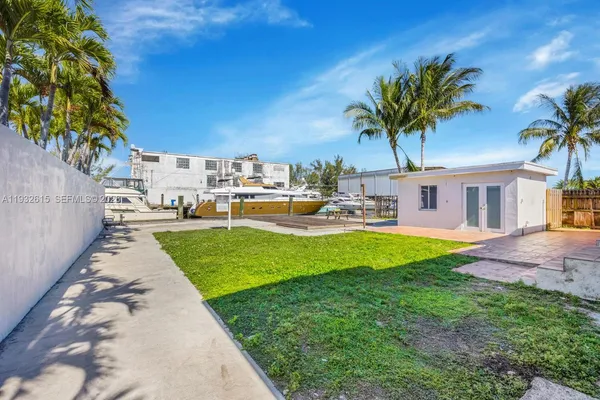 a view of a backyard with a patio