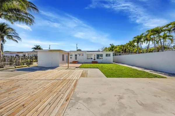 a view of swimming pool with a yard