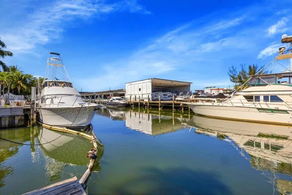 a swimming pool with outdoor seating and yard