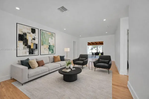 a living room with furniture and a couch