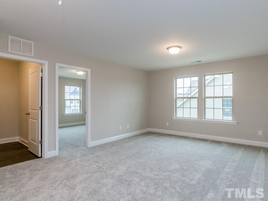 131 Weldon Lane Angier, NC 27501 - Photo 13 of 24 an empty room with windows and closet