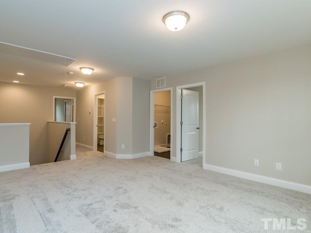 131 Weldon Lane Angier, NC 27501 - Photo 14 of 24 an empty room with a bathroom