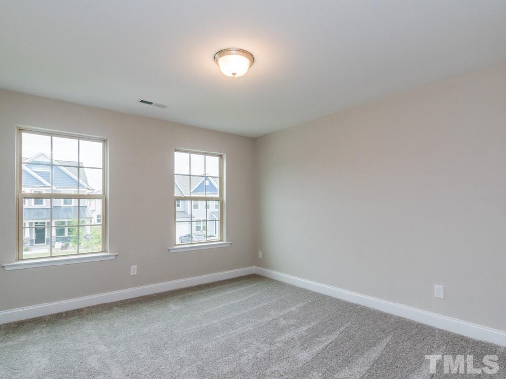 131 Weldon Lane Angier, NC 27501 - Photo 19 of 24 an empty room with windows