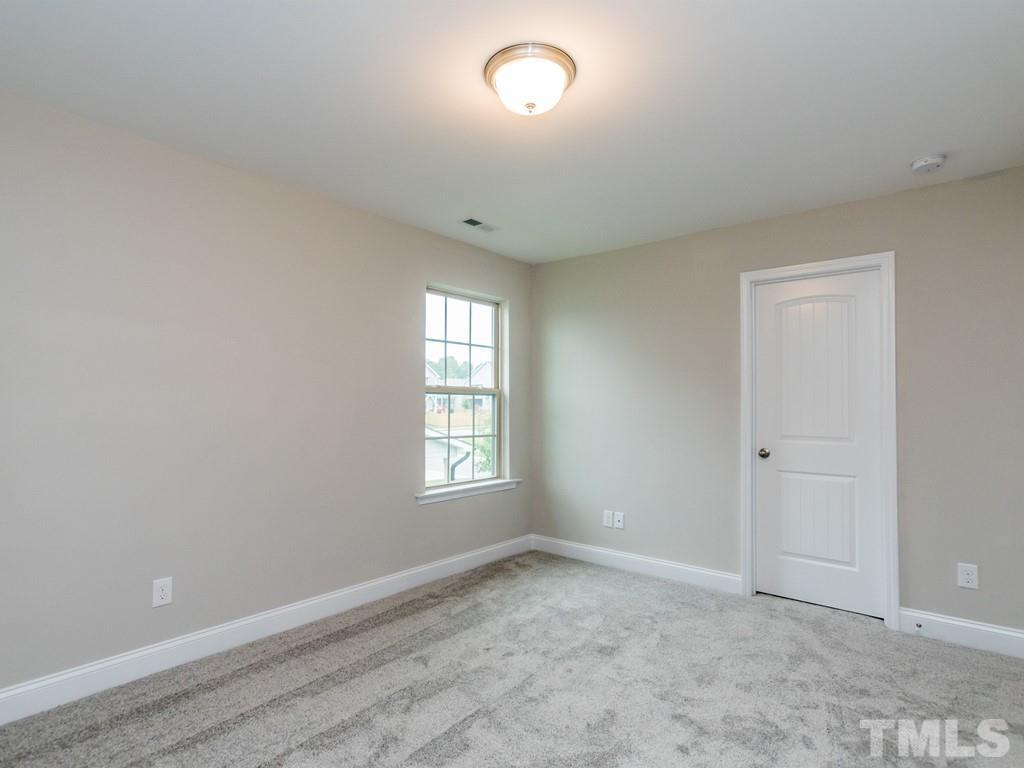131 Weldon Lane Angier, NC 27501 - Photo 21 of 24 an empty room with windows and closet
