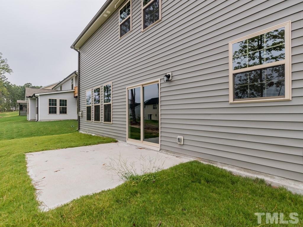 131 Weldon Lane Angier, NC 27501 - Photo 22 of 24 a view of a house with a backyard