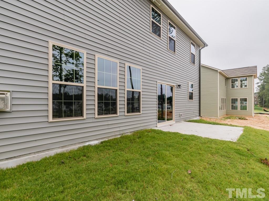 131 Weldon Lane Angier, NC 27501 - Photo 23 of 24 a front view of a house with a garden