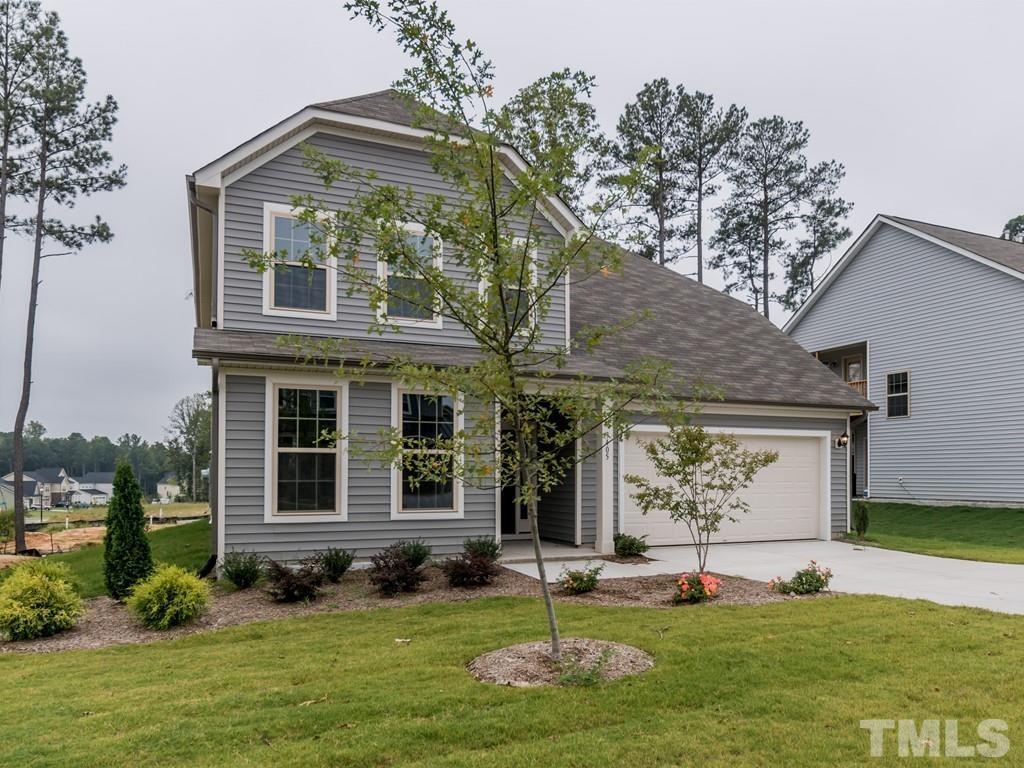 131 Weldon Lane Angier, NC 27501 - Photo 24 of 24 a front view of a house with a yard and garage