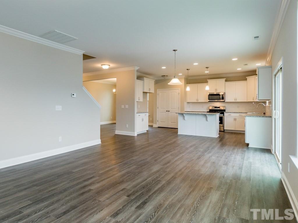 131 Weldon Lane Angier, NC 27501 - Photo 7 of 24 a view of kitchen with wooden floor