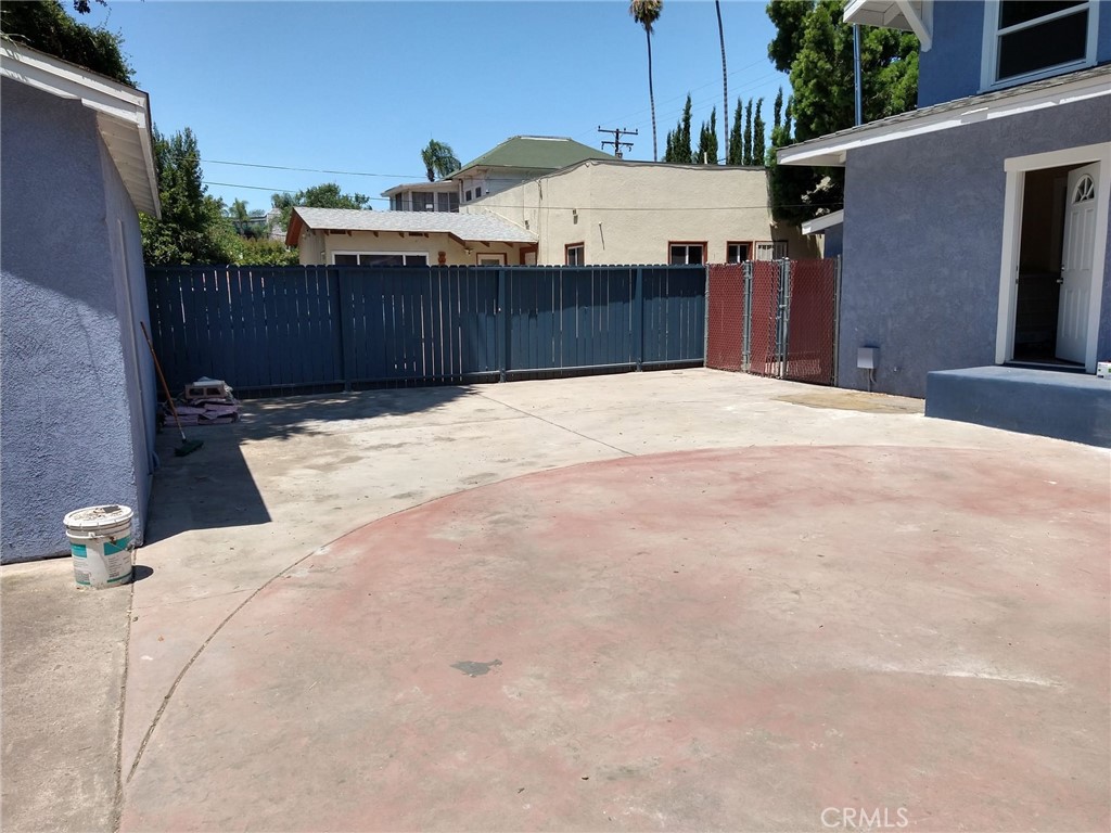 202 West 20th Street Santa Ana, CA 92706 - Photo 11 of 13 a view of a backyard with a sink and wooden fence
