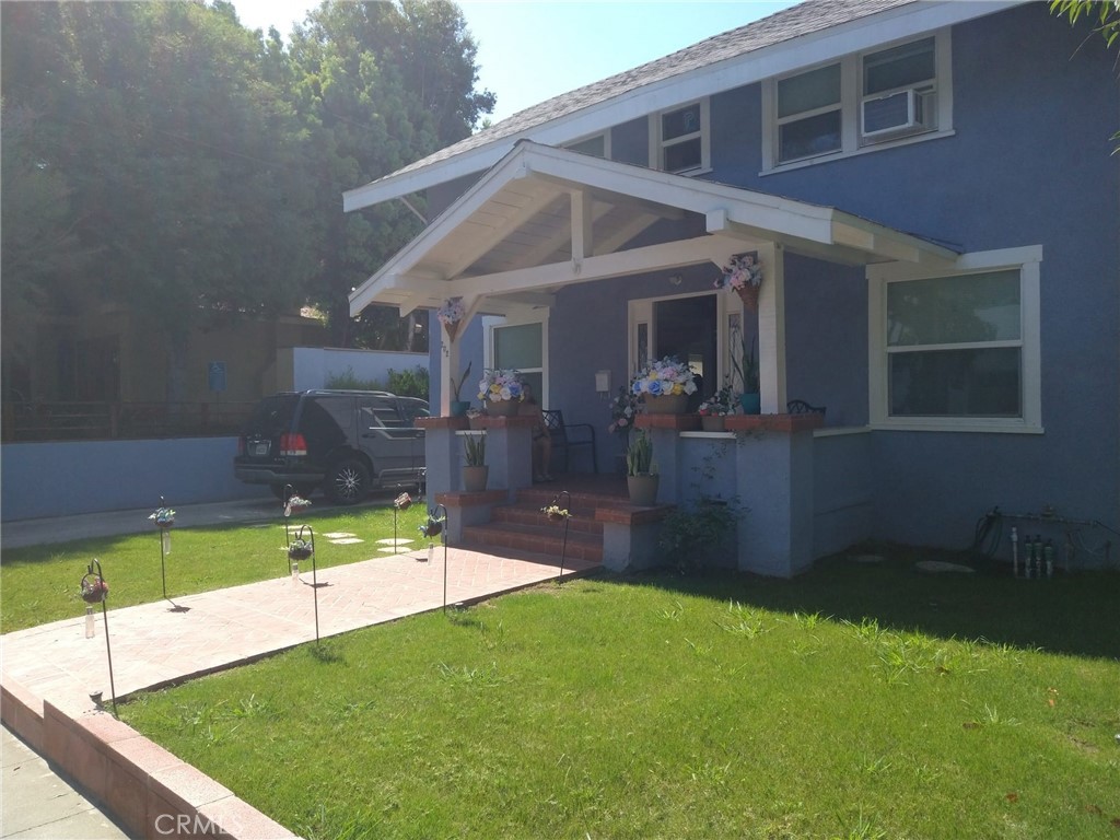 202 West 20th Street Santa Ana, CA 92706 - Photo 2 of 13 a view of a house with a yard
