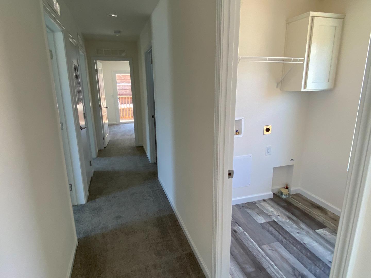 128 Pera Drive, Unit 128 Watsonville, CA 95076 - Photo 19 of 29 a view of a room with wooden floor and staircase